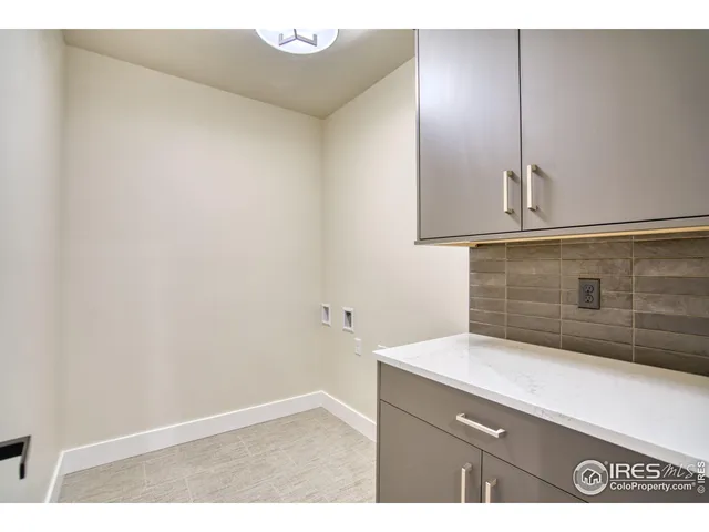 a bathroom with a granite countertop sink a toilet a mirror a bathtub and shower