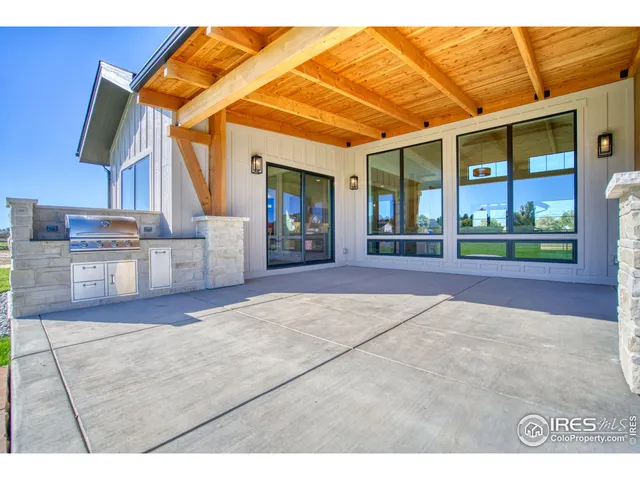 a view of a house with backyard and porch