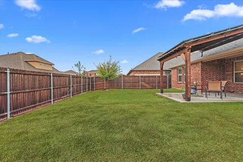 a view of a backyard with a garden and plants
