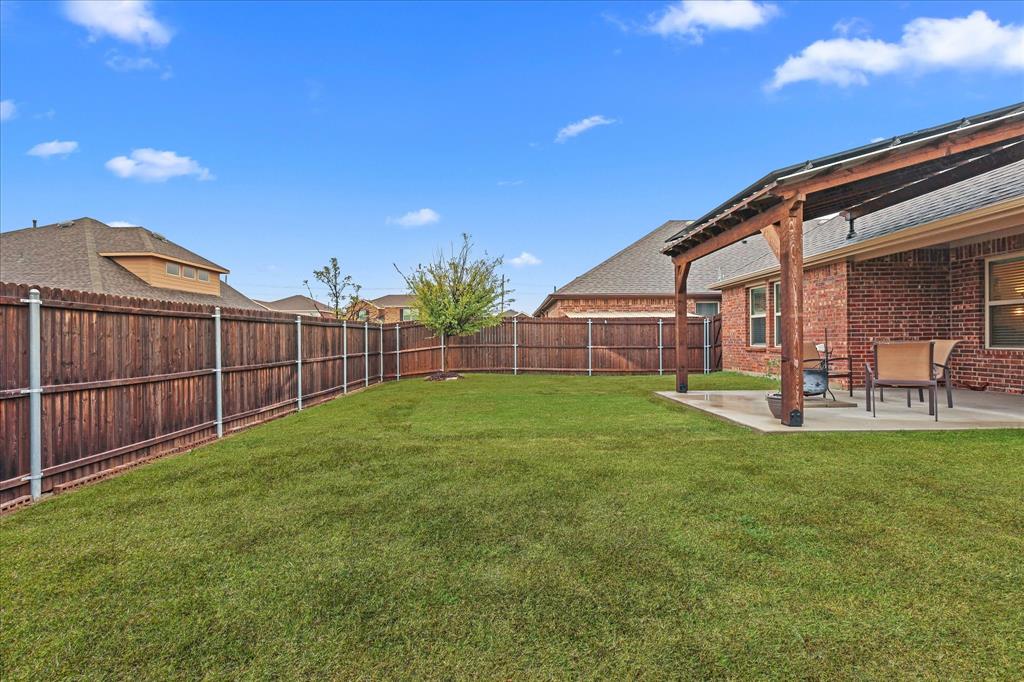 a view of a backyard with a garden and plants