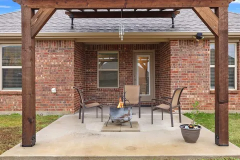 a patio with table and chairs