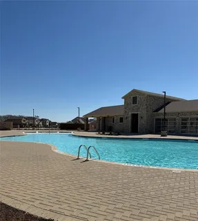 a view of a lake with a yard