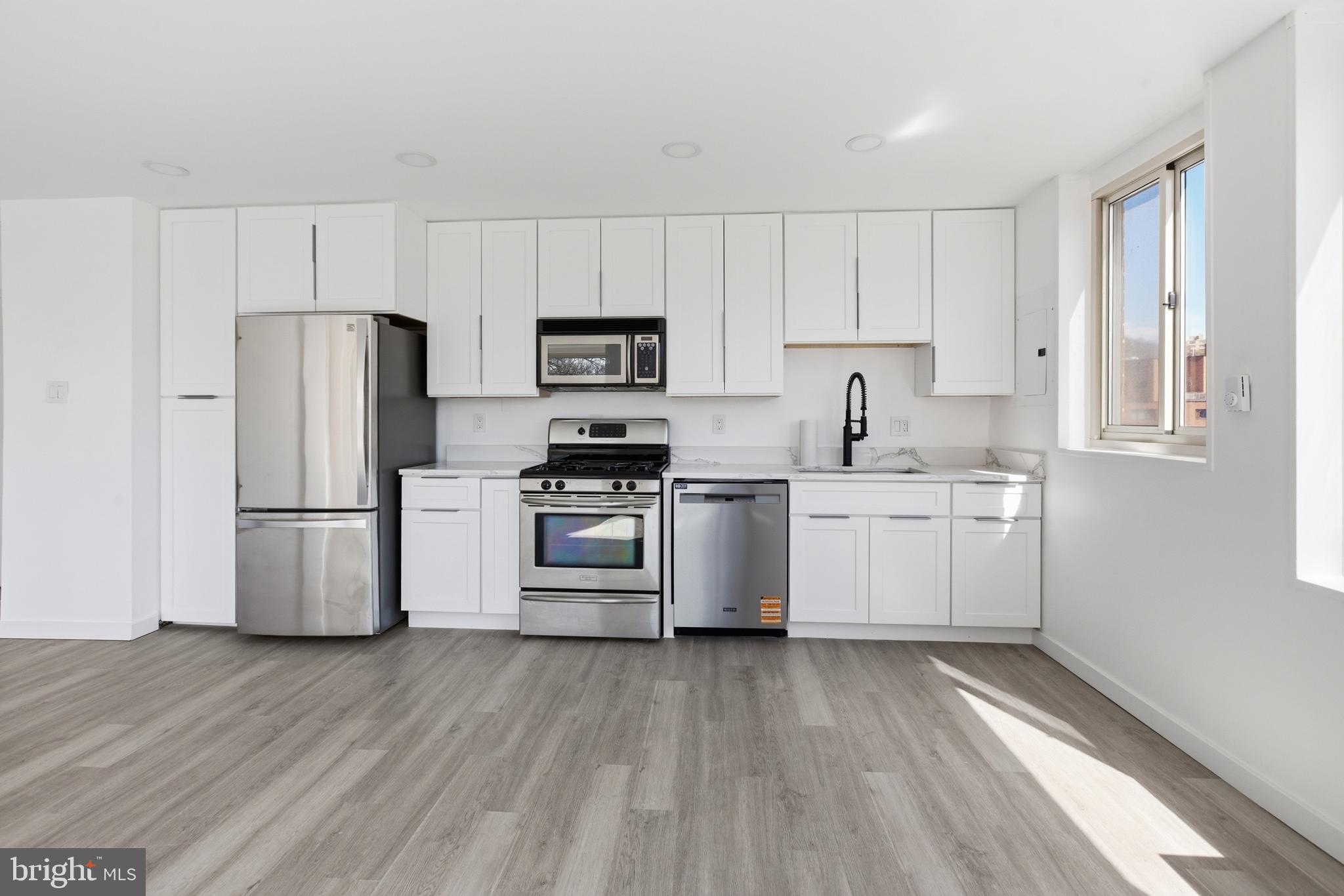 4000 Tunlaw Road Northwest, Unit 611 Washington, DC 20007 - Photo 21 of 29 New Kitchen with Stainless Appliances