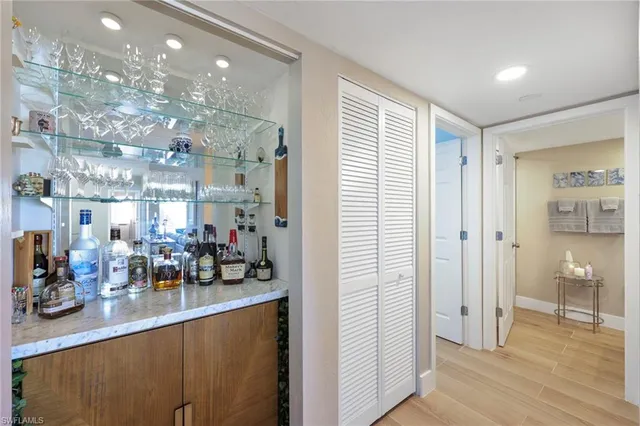 a room with lots of counter top space and wooden floor