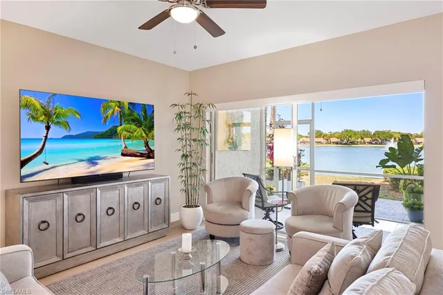 a living room with furniture a rug and a window