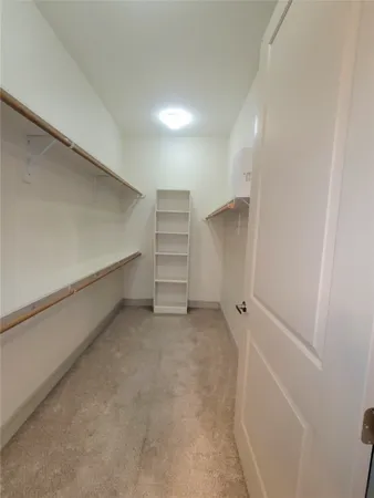 a view of an empty walk in closet
