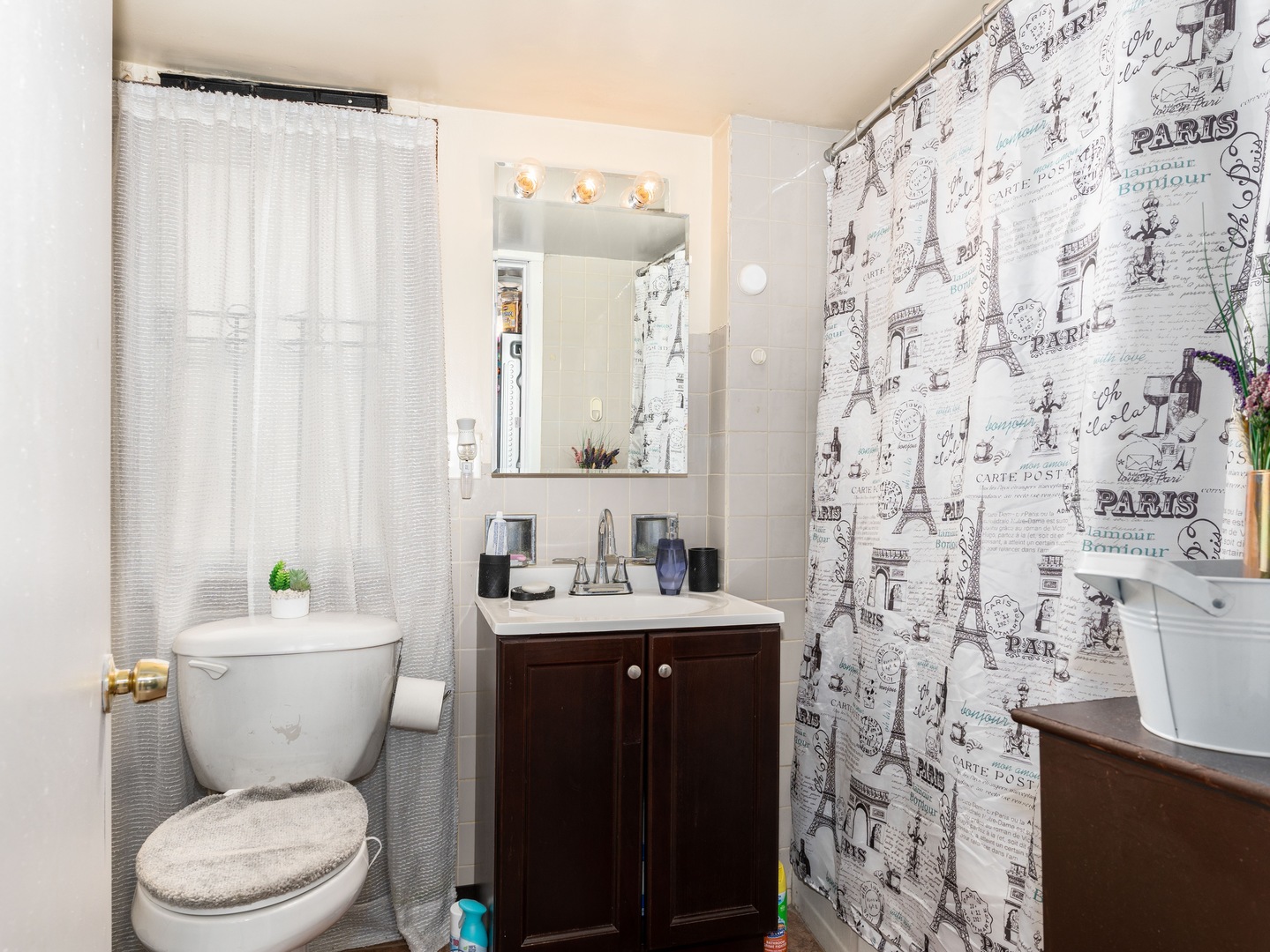 Undisclosed Address Chicago, IL 60651 - Photo 17 of 19 a bathroom with a sink a toilet and a mirror