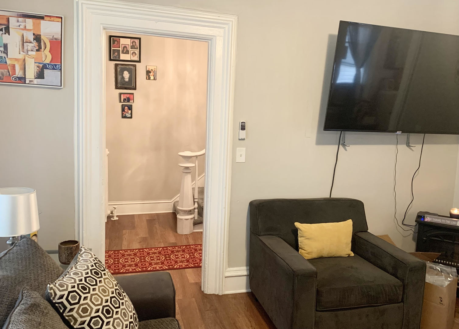 Undisclosed Address Chicago, IL 60651 - Photo 18 of 19 a living room with furniture and a lamp