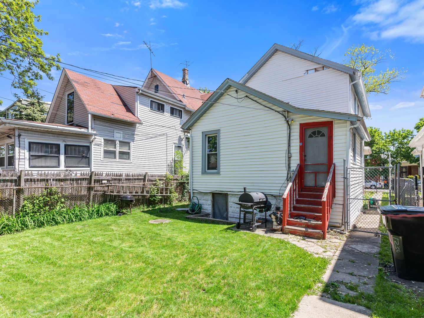 Undisclosed Address Chicago, IL 60651 - Photo 19 of 19 a front view of a house with a garden