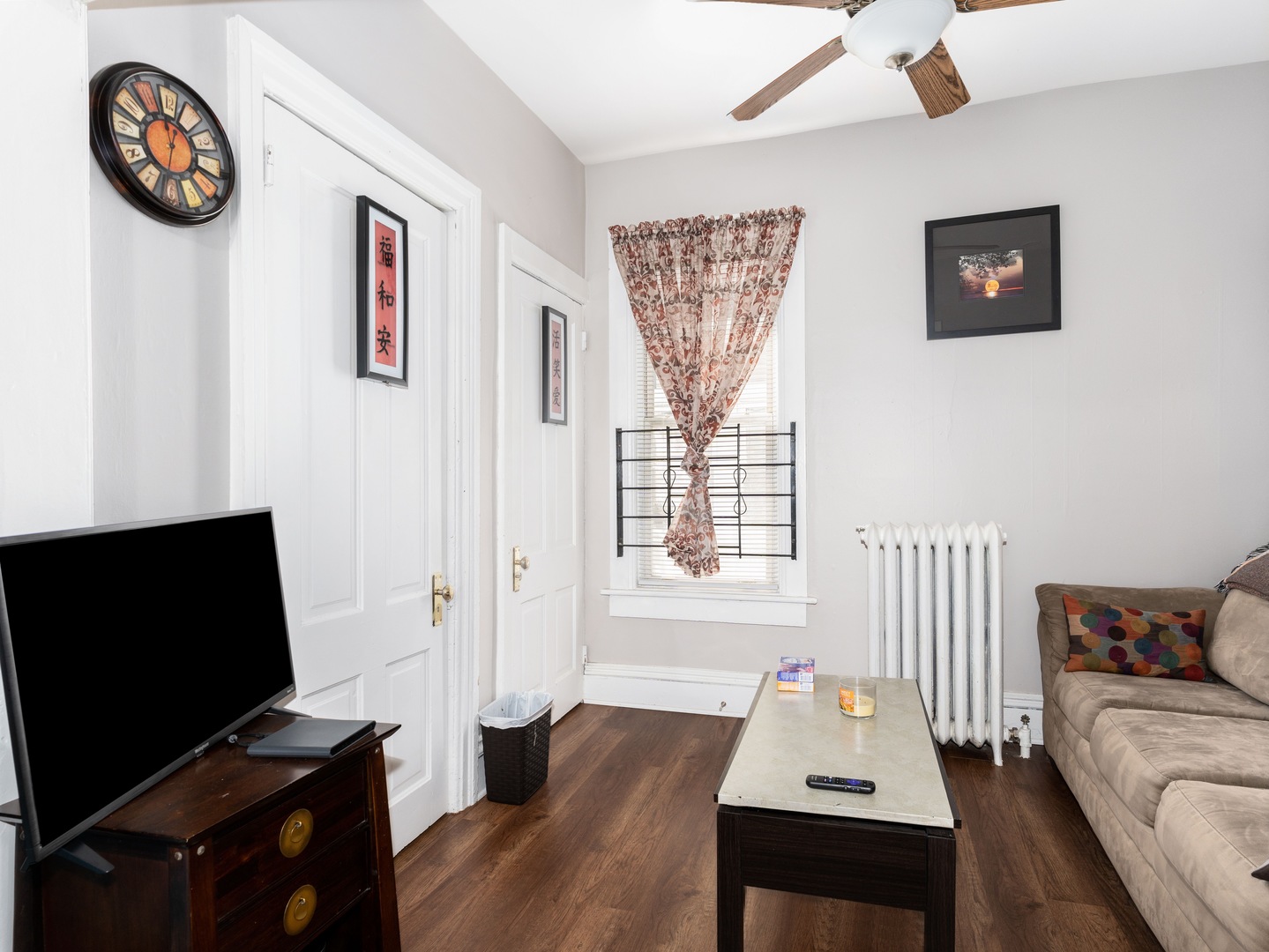 Undisclosed Address Chicago, IL 60651 - Photo 7 of 19 a living room with furniture and a flat screen tv