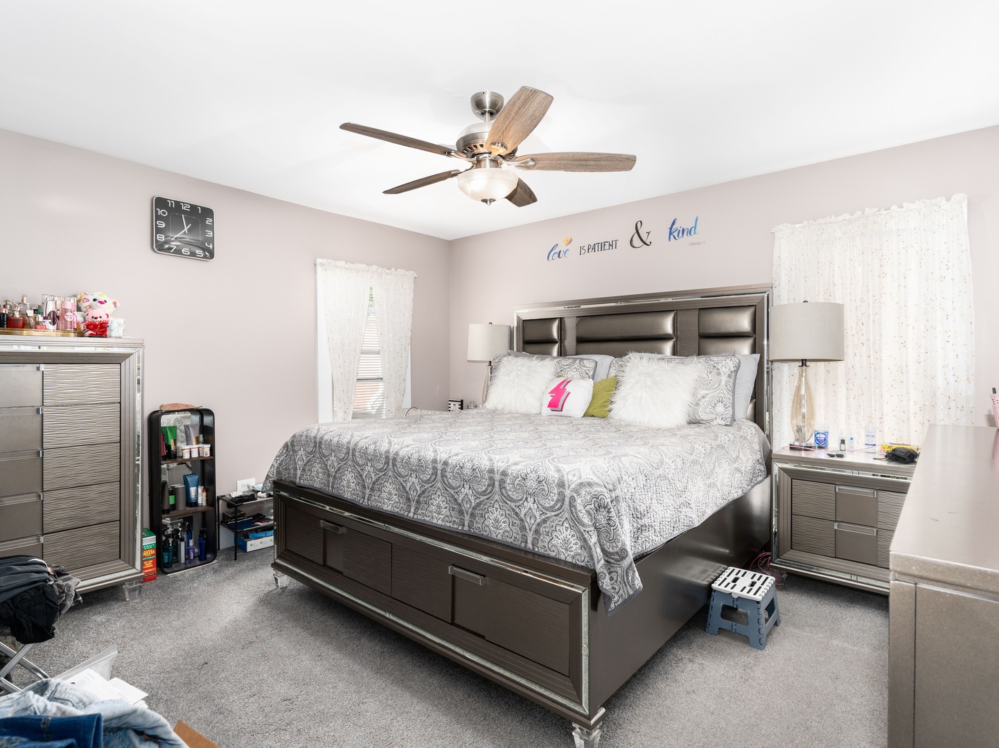 Undisclosed Address Chicago, IL 60651 - Photo 8 of 19 a bed room with a bed and a chandelier