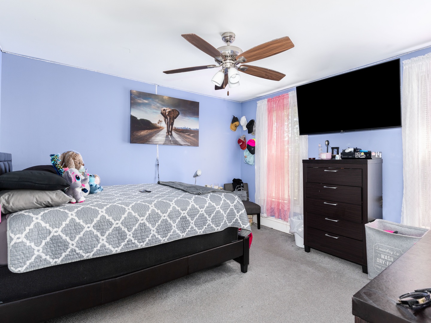 Undisclosed Address Chicago, IL 60651 - Photo 10 of 19 a bedroom with a bed and a flat screen tv