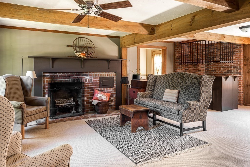 4 Chestnut Street Hopkinton, MA 01748 - Photo 12 of 40 a living room with furniture and a fireplace
