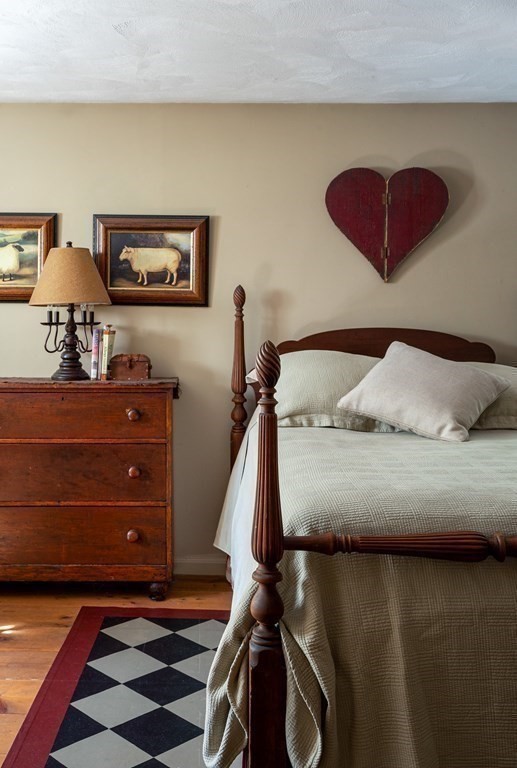 4 Chestnut Street Hopkinton, MA 01748 - Photo 20 of 40 a bedroom with a bed and a lamp on dresser