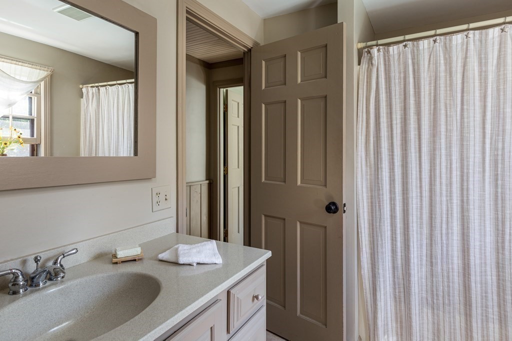 4 Chestnut Street Hopkinton, MA 01748 - Photo 21 of 40 a bathroom with a double vanity sink and a mirror