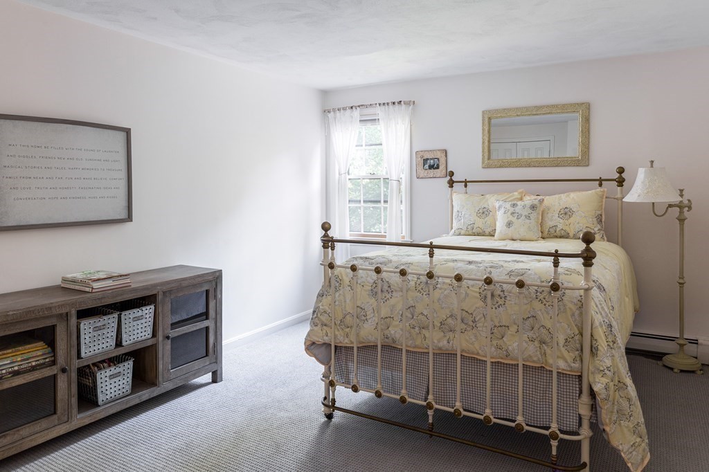 4 Chestnut Street Hopkinton, MA 01748 - Photo 24 of 40 a bedroom with furniture and window