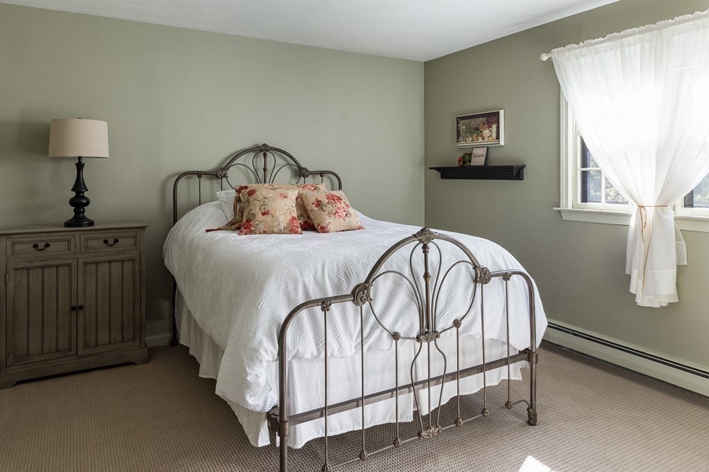 4 Chestnut Street Hopkinton, MA 01748 - Photo 25 of 40 a bedroom with a bed and a window