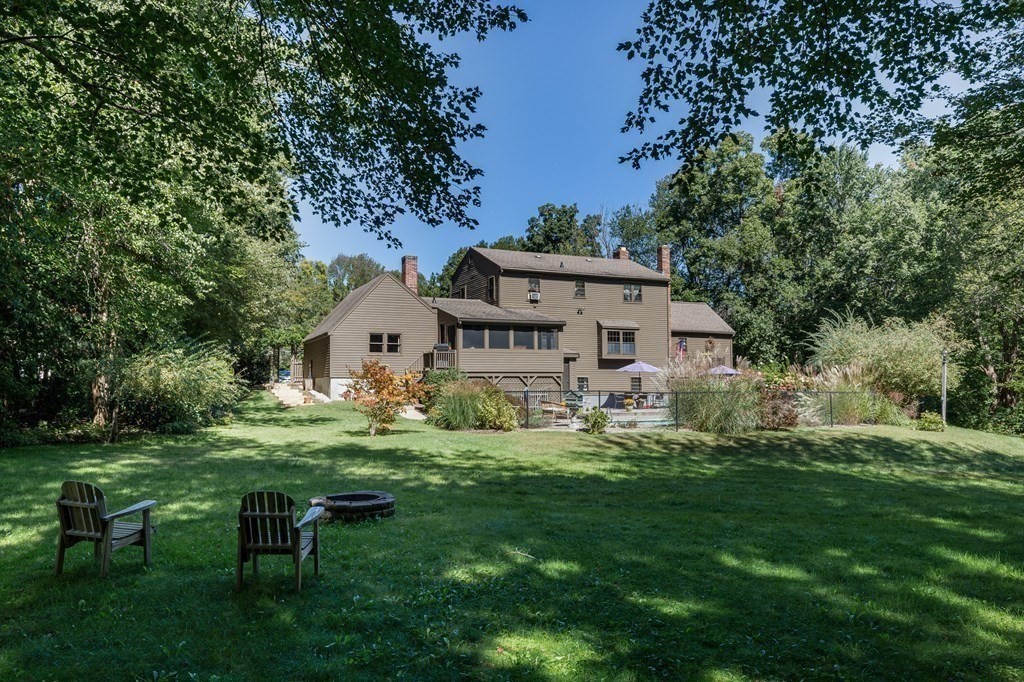 4 Chestnut Street Hopkinton, MA 01748 - Photo 3 of 40 a front view of a house with a garden