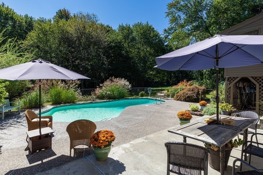 4 Chestnut Street Hopkinton, MA 01748 - Photo 33 of 40 a view of backyard with outdoor seating and trees