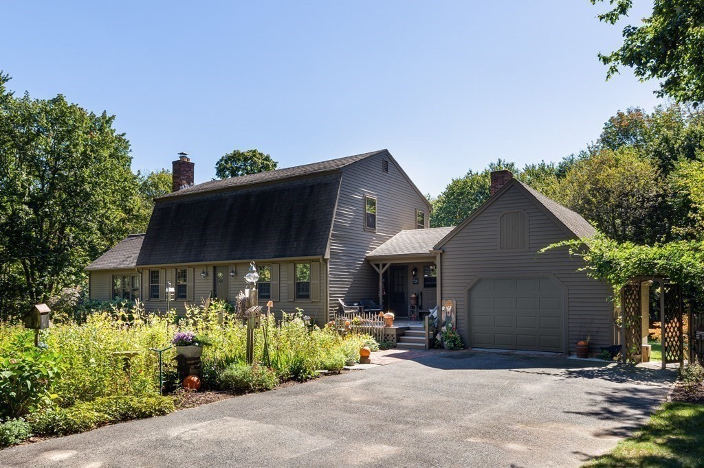 4 Chestnut Street Hopkinton, MA 01748 - Photo 39 of 40 a front view of a house with garden