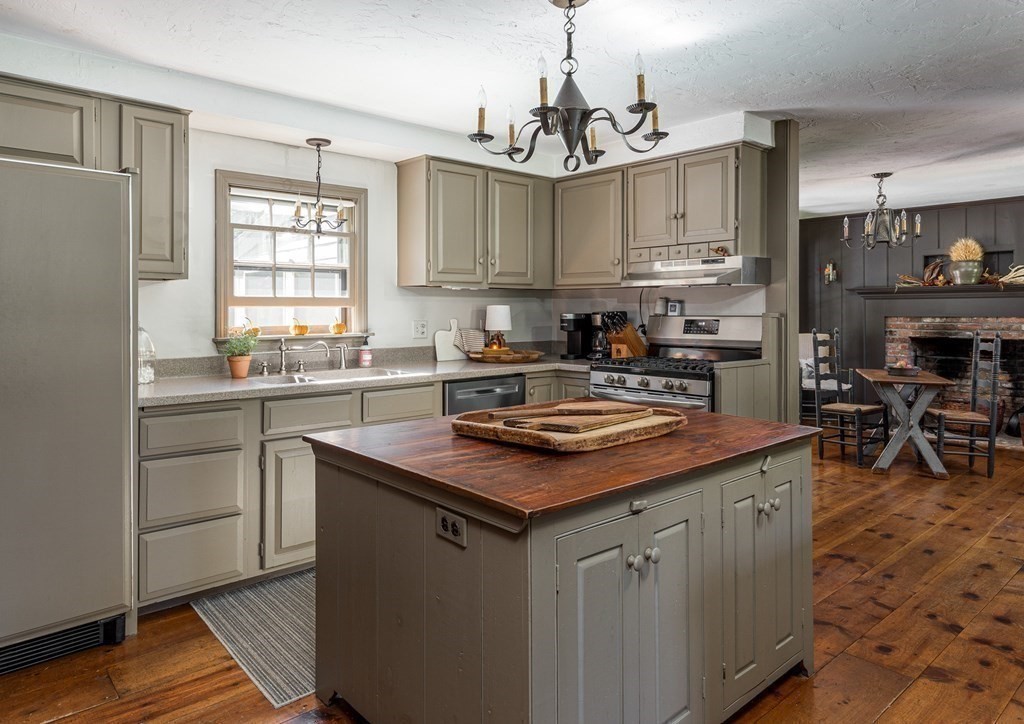 4 Chestnut Street Hopkinton, MA 01748 - Photo 7 of 40 a kitchen with stainless steel appliances granite countertop a sink stove and refrigerator