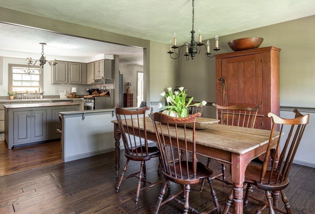4 Chestnut Street Hopkinton, MA 01748 - Photo 9 of 40 a view of a dining room with furniture and chandelier