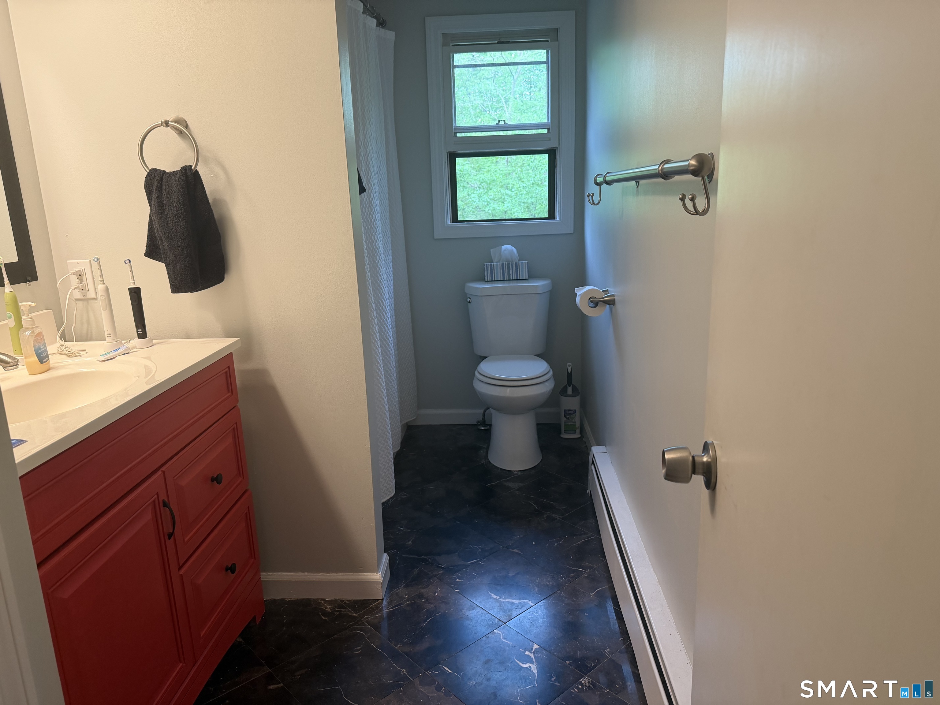 71 Mountain Road Hartland, CT 06027 - Photo 5 of 8 a bathroom with a sink a toilet and shower
