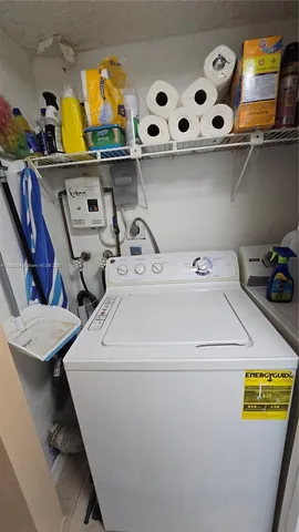 a bathroom with a toilet sink and shower