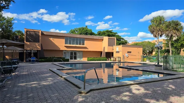 a view of a swimming pool with a lounge chairs