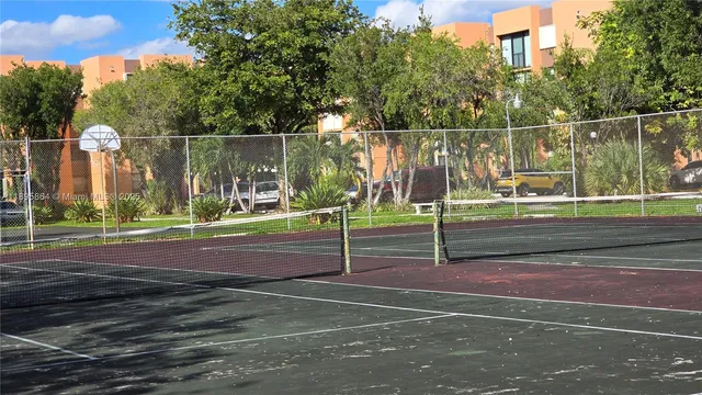 a view of house with a backyard