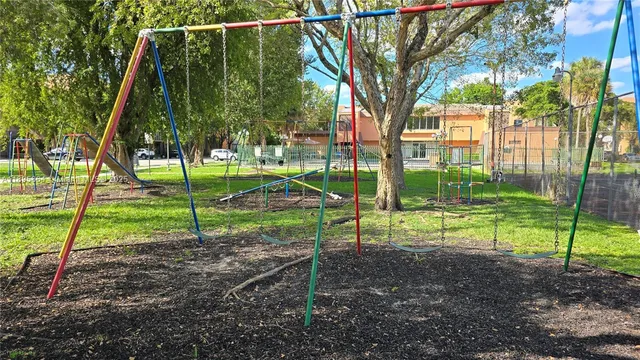 a view of a park with large trees