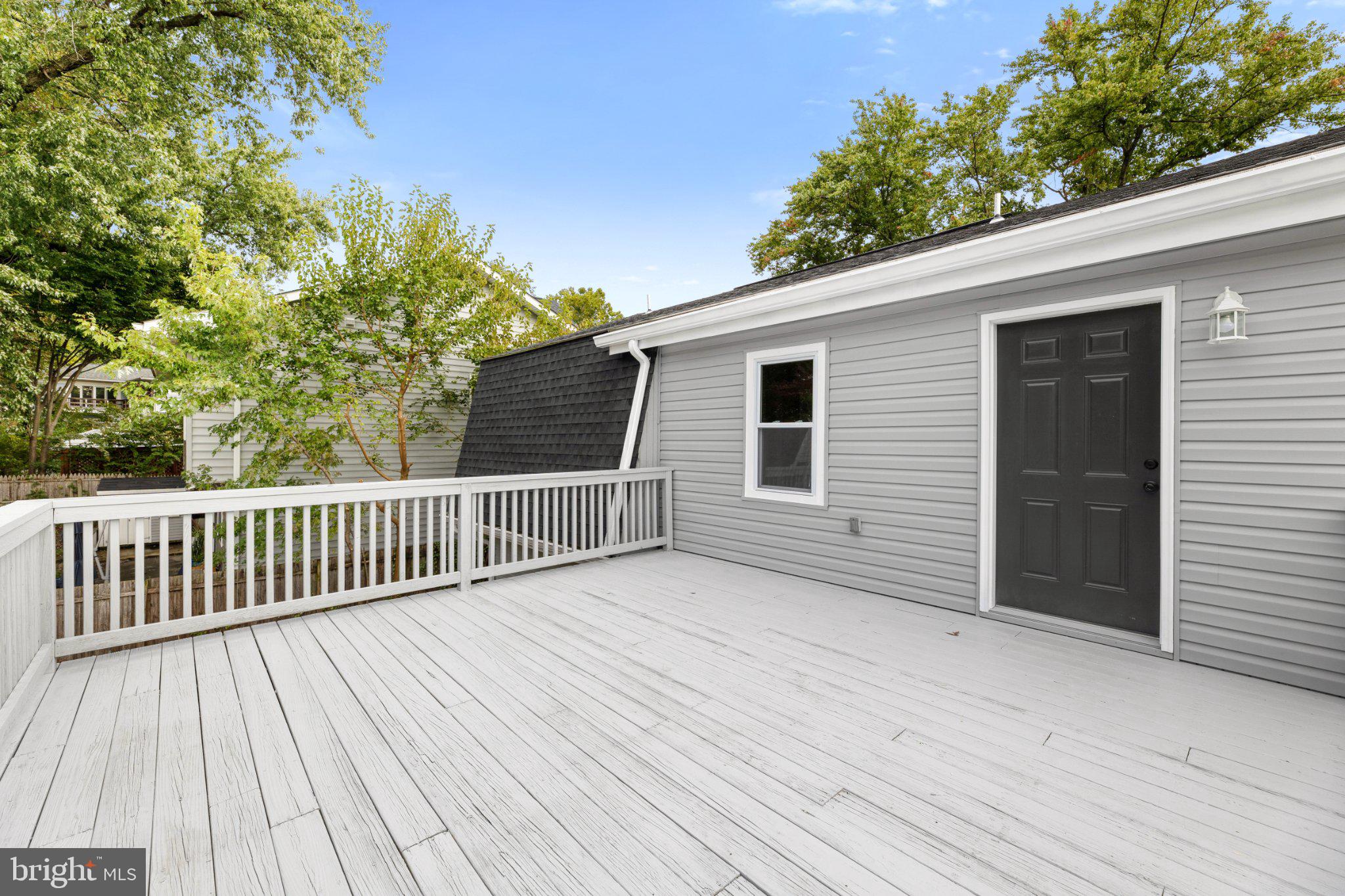 3215 Edgewood Road Kensington, MD 20895 - Photo 32 of 37 Charming deck with serene greenery.