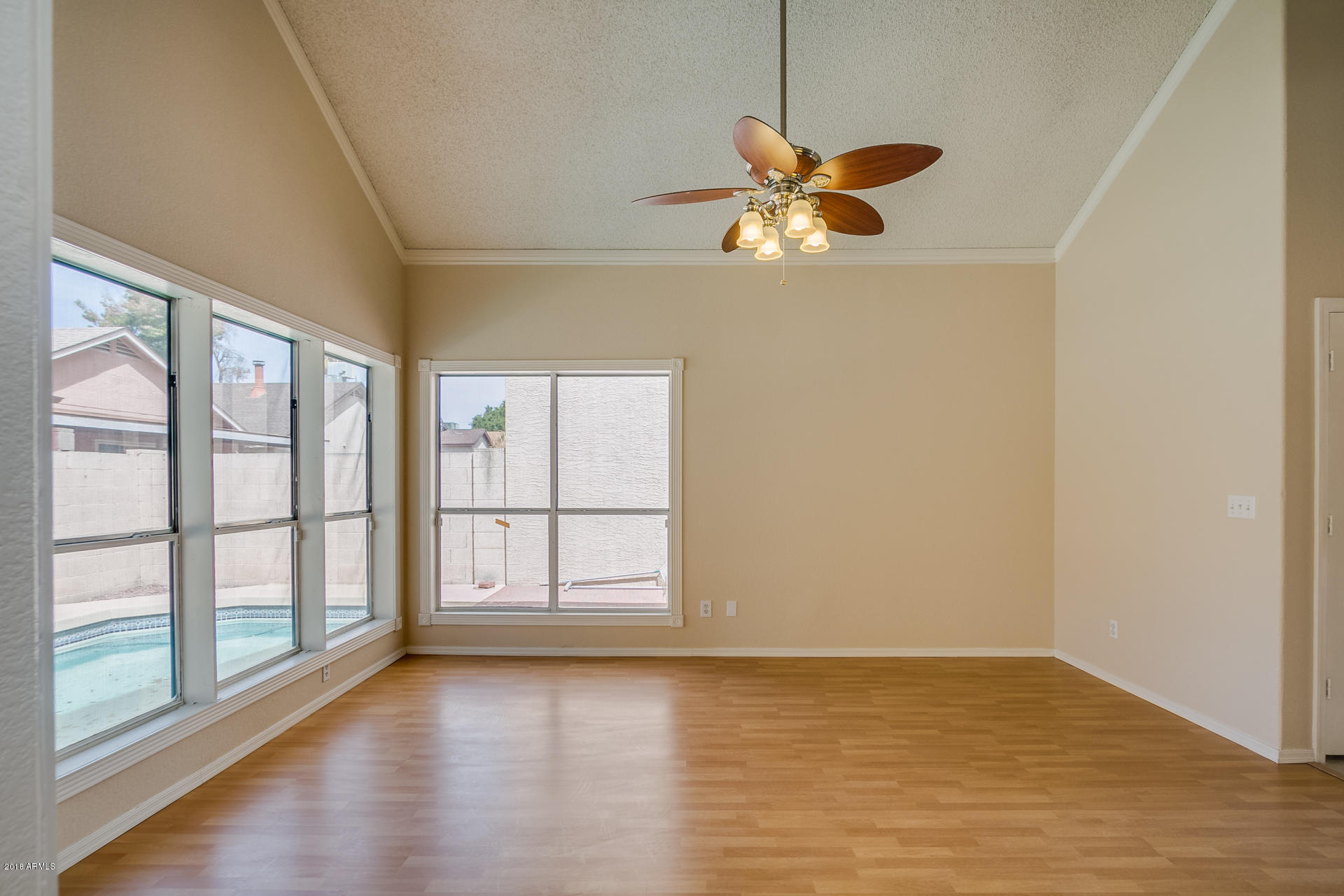 522 East Utopia Road Phoenix, AZ 85024 - Photo 13 of 35 wooden floor in an empty room with a window