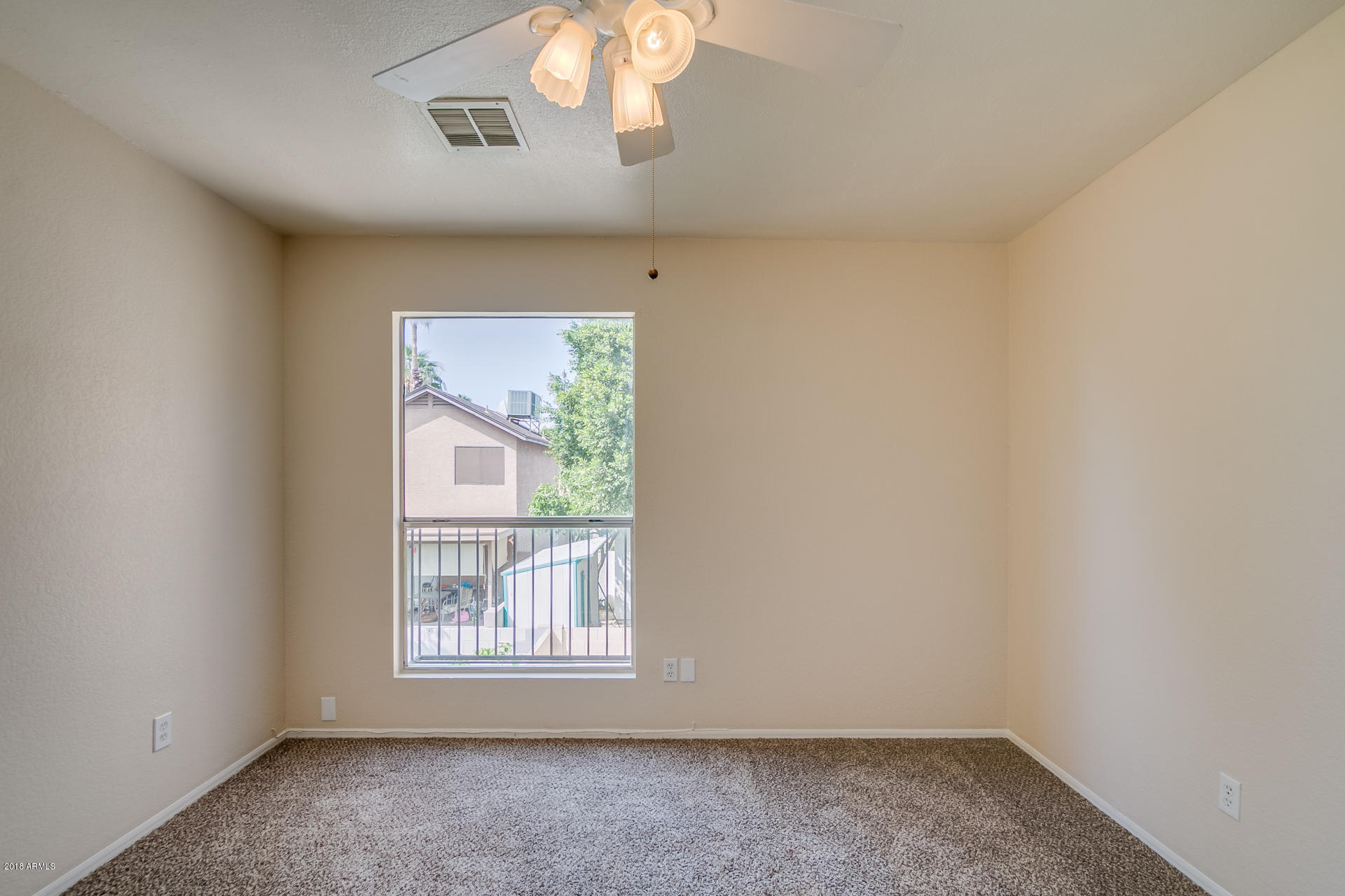 522 East Utopia Road Phoenix, AZ 85024 - Photo 16 of 35 an empty room with a window