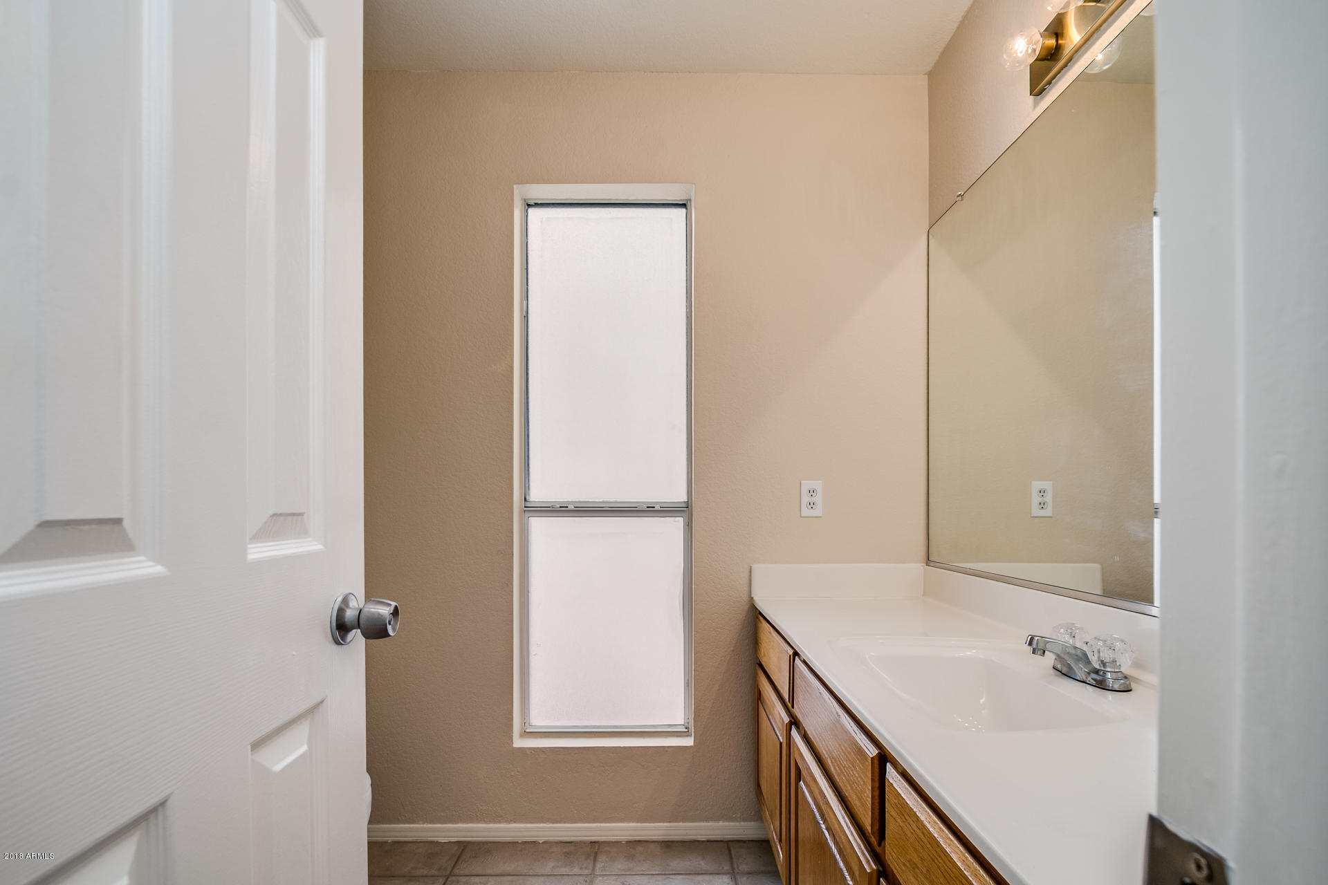 522 East Utopia Road Phoenix, AZ 85024 - Photo 18 of 35 a bathroom with a sink and a mirror