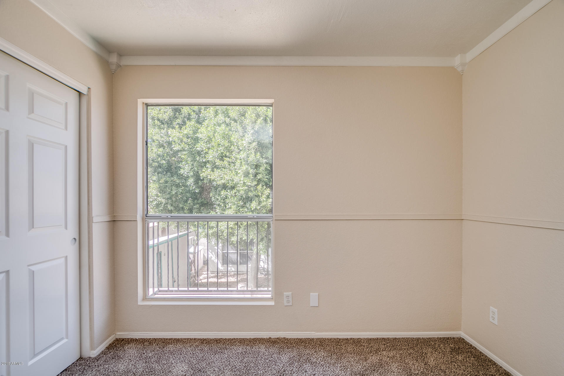 522 East Utopia Road Phoenix, AZ 85024 - Photo 20 of 35 an empty room with wooden floor and windows