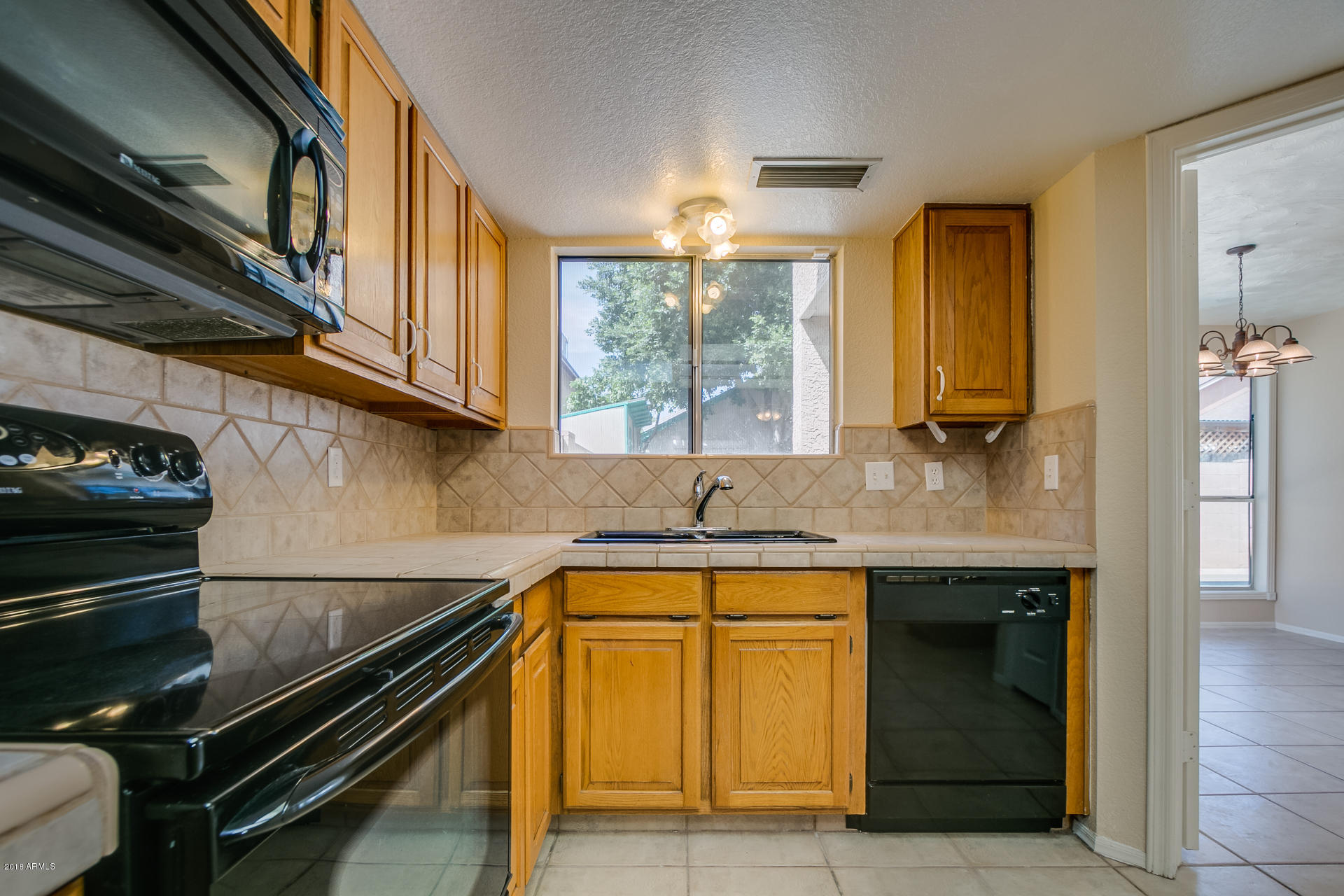522 East Utopia Road Phoenix, AZ 85024 - Photo 2 of 35 a kitchen with a sink and cabinets