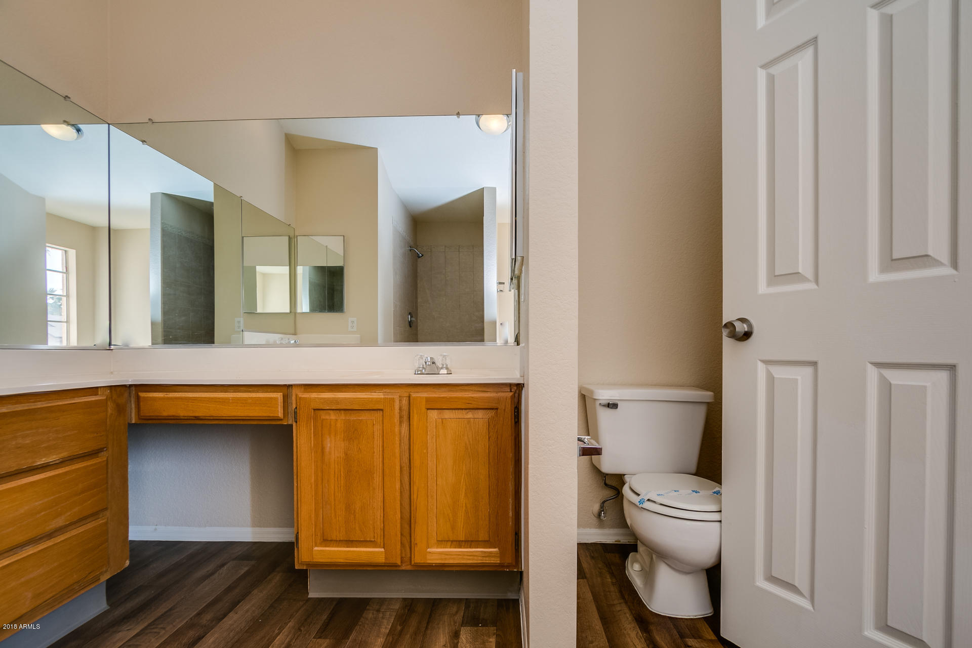 522 East Utopia Road Phoenix, AZ 85024 - Photo 30 of 35 a bathroom with a toilet sink and mirror