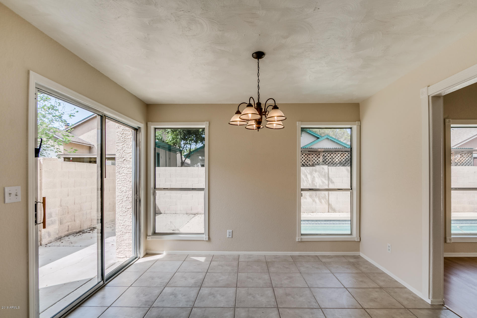522 East Utopia Road Phoenix, AZ 85024 - Photo 3 of 35 a view of an empty room and window