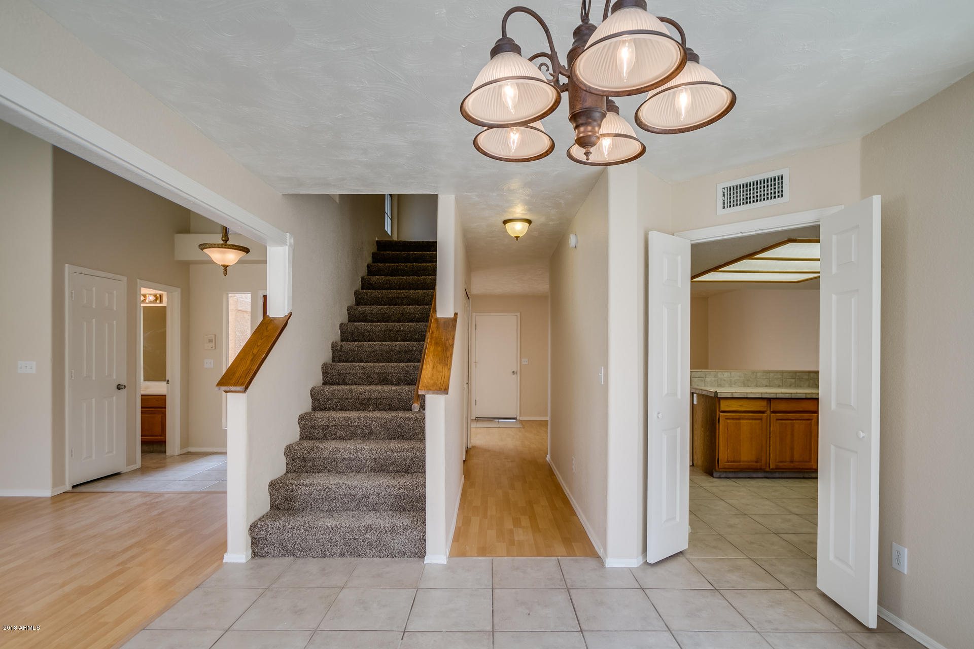522 East Utopia Road Phoenix, AZ 85024 - Photo 4 of 35 a view of entryway and hall with wooden floor