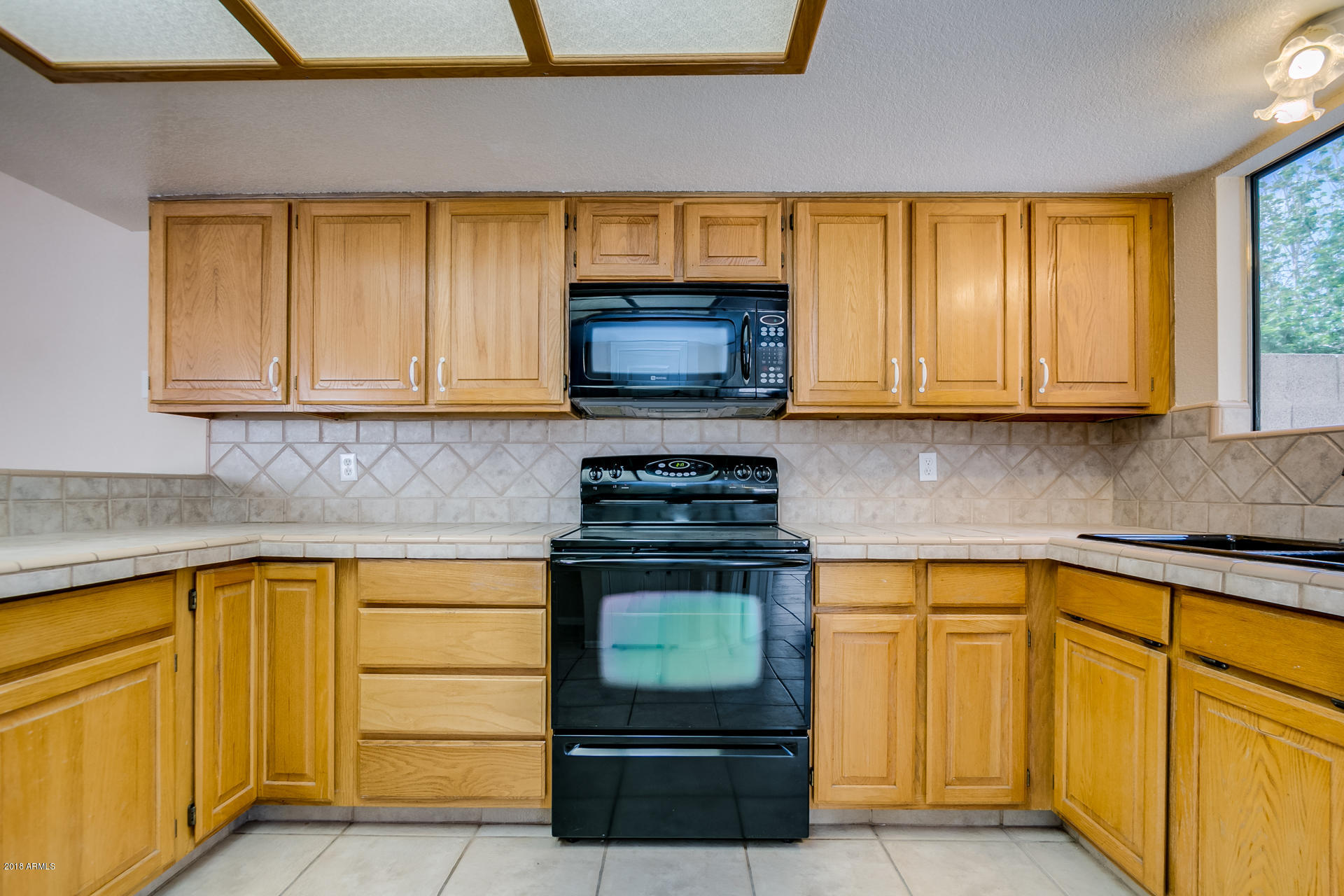 522 East Utopia Road Phoenix, AZ 85024 - Photo 6 of 35 a kitchen with granite countertop cabinets stainless steel appliances and a sink