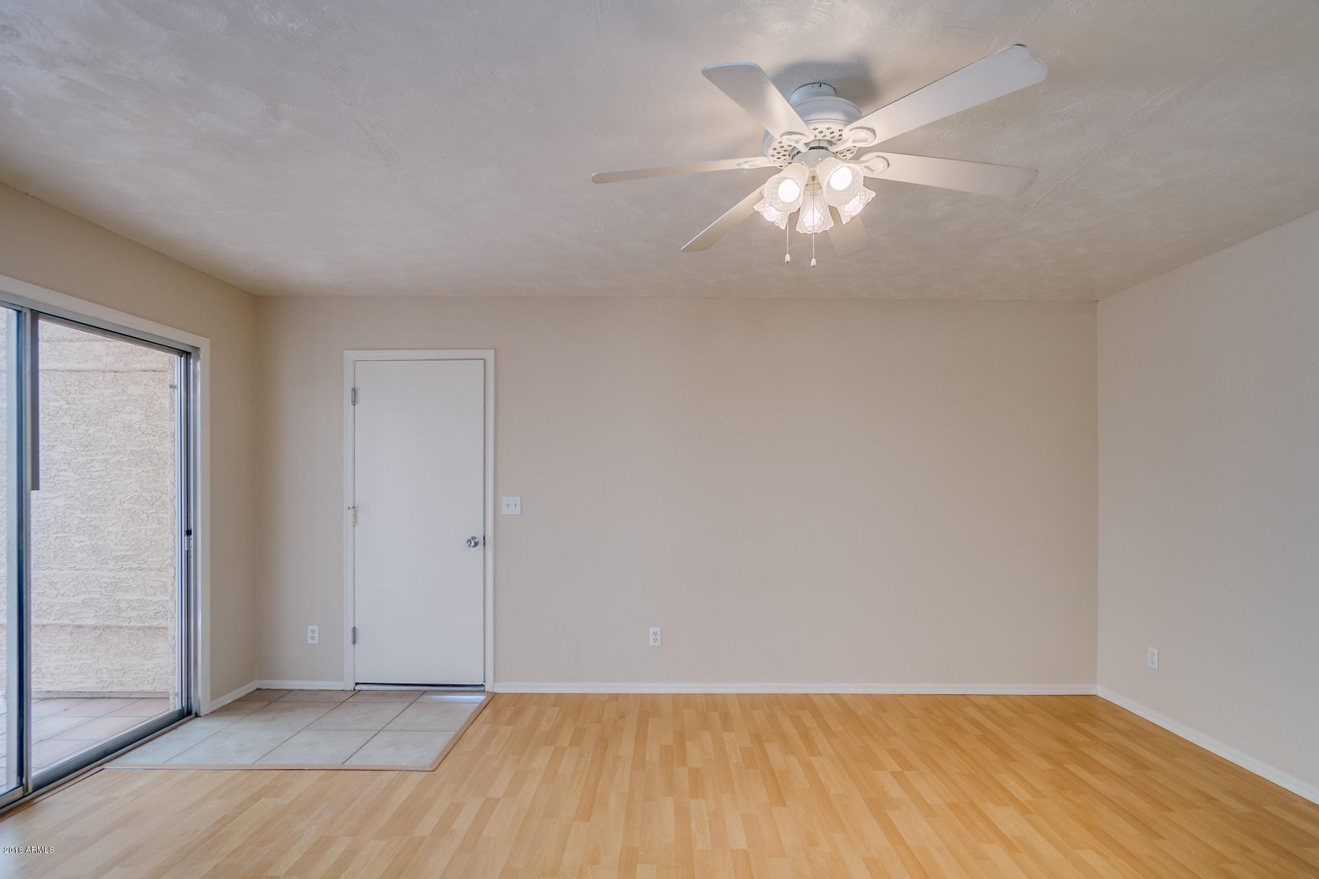 522 East Utopia Road Phoenix, AZ 85024 - Photo 9 of 35 an empty room with wooden floor and windows