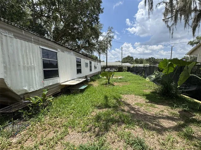 a backyard of a house with lots of green space