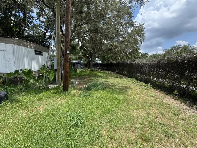 a backyard of a house with lots of green space
