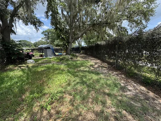 a backyard of a house with lots of green space