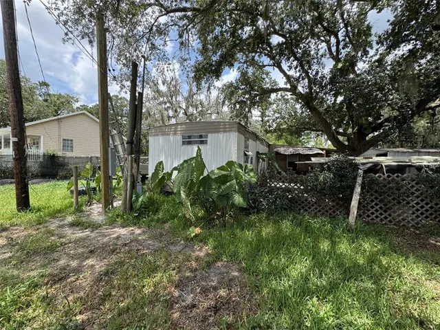 a backyard of a house with lots of green space