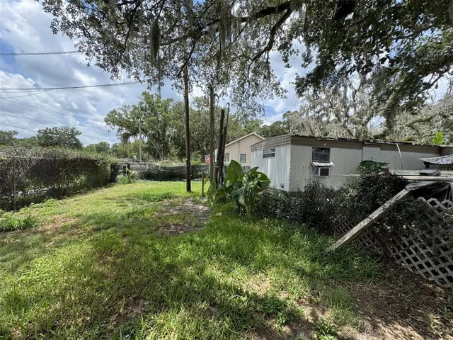 a view of backyard with green space
