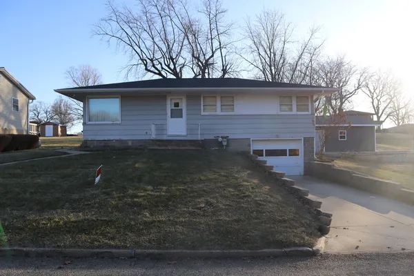 a front view of a house with yard