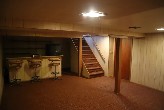a view of an empty room with stairs
