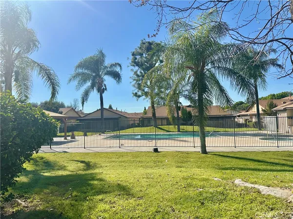 a view of swimming pool with a table and chairs